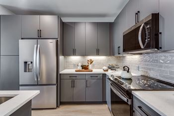 Gourmet prep islands with pendant lighting*